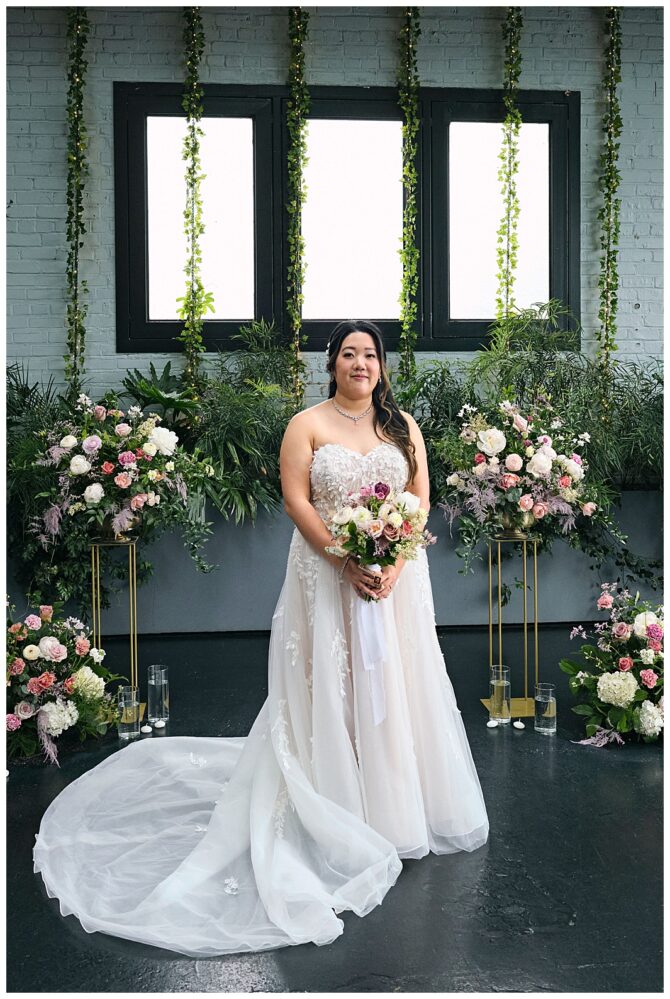 Bride in elegant gown with floral decorations