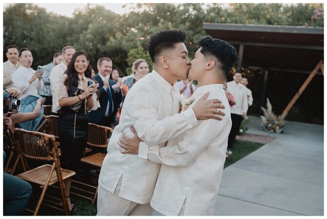 Couple kissing during wedding ceremony celebration