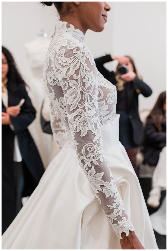 Elegant lace wedding dress with floral details.